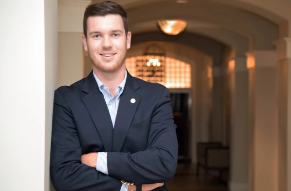 A young man in a business suit.